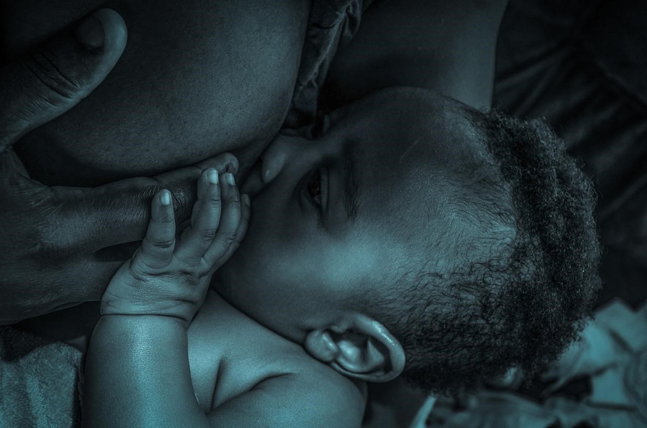 A black mother and baby during breastfeeding