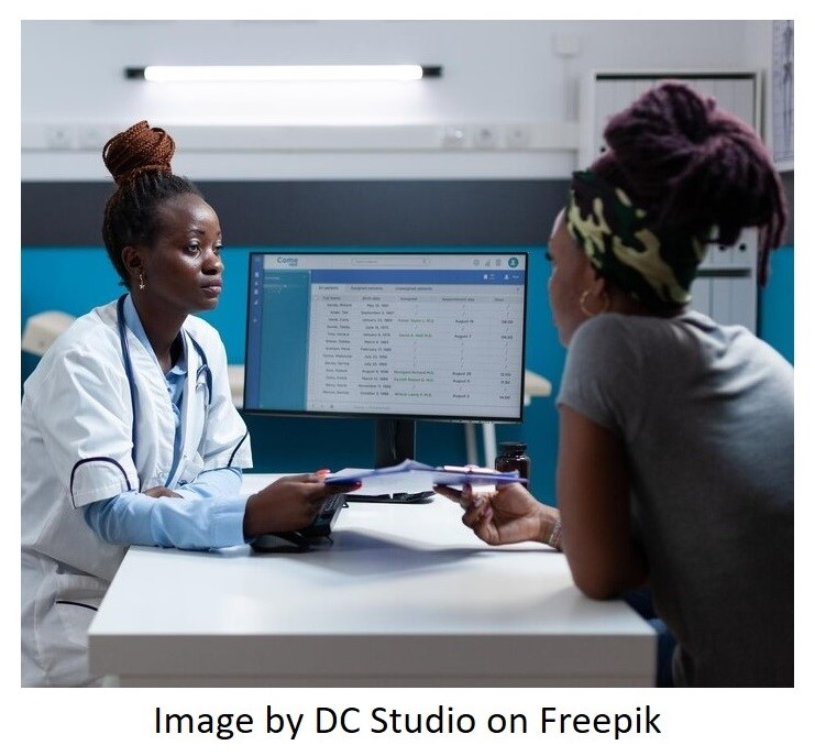 Female doctor in consultation with female patient in doctor's office