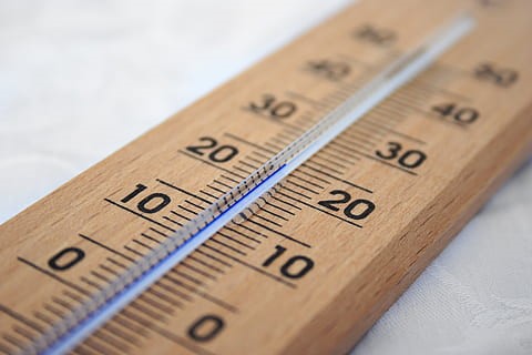 A thermometer inlaid on wood