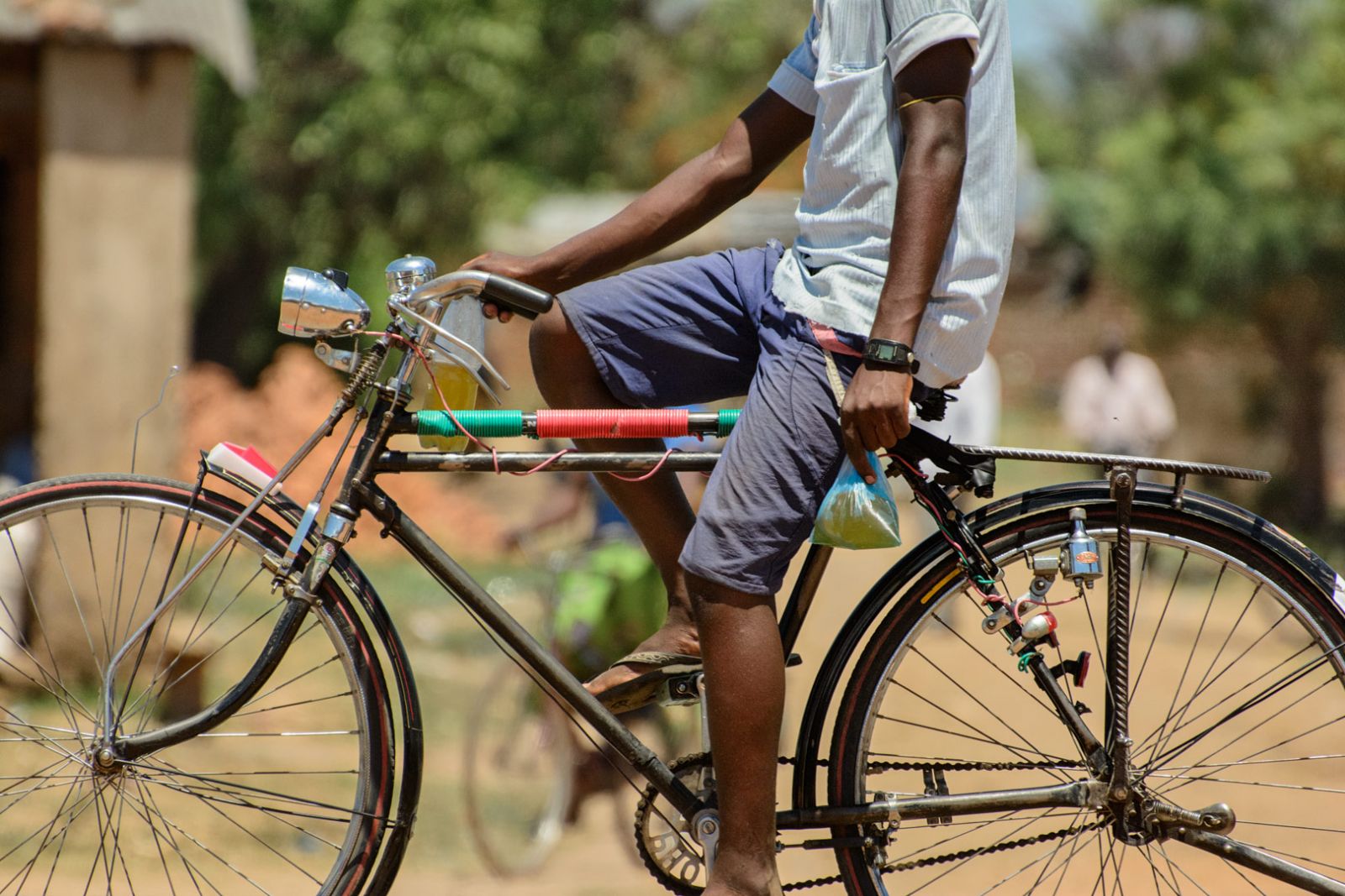 Black African man on a bike