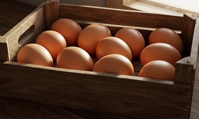 Brown egges in a wodden box