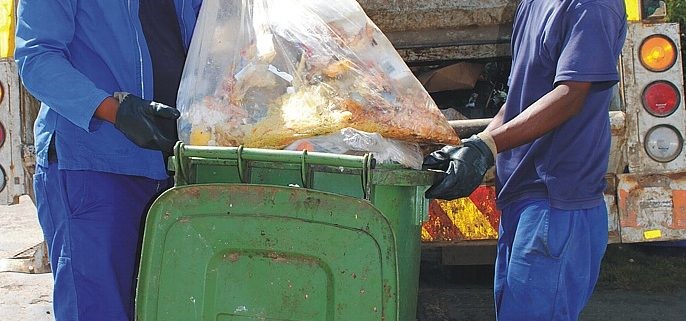 Image showing men clearing waste from a premises
