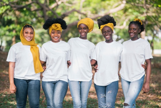 A group of young black women posing together outdoors