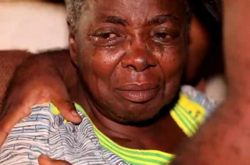 Grieving and sad looking African woman with teary eyes