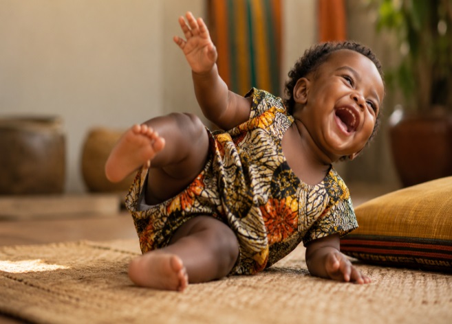 Photo of an African toddler boy in playful fall