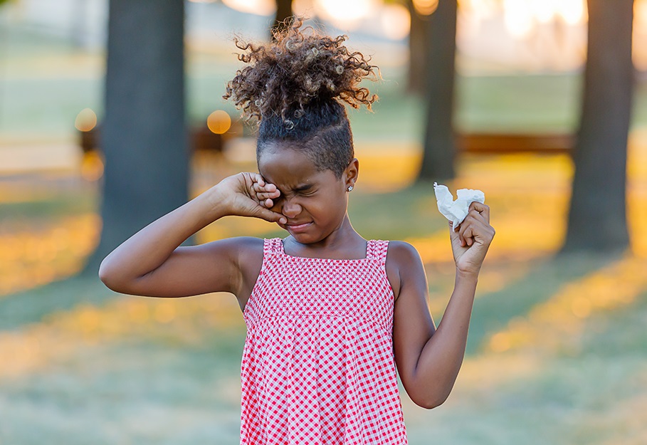 Young African girl running her eyes